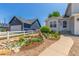 Charming home with a well-maintained yard, pretty landscaping and a white picket fence at 606 Beth Ave, Fort Lupton, CO 80621