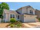 Charming two-story home with a well-manicured lawn and inviting curb appeal at 606 Beth Ave, Fort Lupton, CO 80621