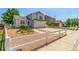 Inviting two-story home with a manicured yard, white fence, and spacious driveway at 606 Beth Ave, Fort Lupton, CO 80621