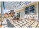 Enjoyable outdoor patio with a white pergola, dining set, and a cozy setting at 606 Beth Ave, Fort Lupton, CO 80621