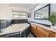 A bathroom featuring a tiled jacuzzi tub, modern mirror and tasteful decor at 19624 E Girard Dr, Aurora, CO 80013