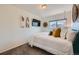 Stylish bedroom with carpet, a window view, and minimalist wall decor at 19624 E Girard Dr, Aurora, CO 80013