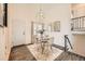 Cozy dining space with hardwood floors, a stylish light fixture, and lots of natural light at 19624 E Girard Dr, Aurora, CO 80013