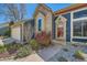 Close-up of a home's front door with a blue exterior, updated landscaping, and visible house number at 19624 E Girard Dr, Aurora, CO 80013