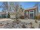 Charming home with a well-maintained front yard, decorative tree, and rock landscaping at 19624 E Girard Dr, Aurora, CO 80013