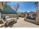 Large patio space complete with an outdoor kitchen, dining table, and plenty of sunshine at 19624 E Girard Dr, Aurora, CO 80013