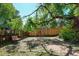 Fenced backyard featuring a vintage playground, a quaint sitting area, and a hammock for relaxing at 260 E Cornwall Ct, Lafayette, CO 80026