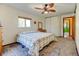 Bedroom featuring carpet, a window with natural light, and closet space at 260 E Cornwall Ct, Lafayette, CO 80026