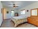 Bedroom featuring a ceiling fan, comfortable carpet, and large windows at 260 E Cornwall Ct, Lafayette, CO 80026