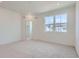 Spacious bedroom with ample natural light and neutral carpet at 14587 W 90Th Ln # B, Arvada, CO 80005