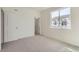 Carpeted bedroom with natural light near closet and door at 14587 W 90Th Ln # B, Arvada, CO 80005