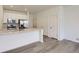 Well-lit kitchen featuring quartz countertops and stainless steel appliances at 14587 W 90Th Ln # B, Arvada, CO 80005