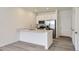 Well-lit kitchen featuring quartz countertops and stainless steel appliances at 14587 W 90Th Ln # B, Arvada, CO 80005