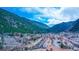Aerial view of picturesque town nestled in mountains with stream at 1890 Argentine St # C301, Georgetown, CO 80444