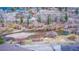Scenic aerial view of a creek flowing through a neighborhood with trees, vegetation, and houses at 1890 Argentine St # C301, Georgetown, CO 80444