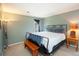 Comfortable bedroom with a stylish bed frame, bench, and soothing decor at 1890 Argentine St # C301, Georgetown, CO 80444