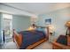 Cozy bedroom with a wood-frame bed, soft lighting, and a view to the outdoors at 1890 Argentine St # C301, Georgetown, CO 80444