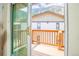 View from inside out to the wooden deck overlooking a mountain at 1890 Argentine St # C301, Georgetown, CO 80444