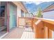 Beautiful view from deck with wooden railing and sliding glass door, perfect for enjoying outdoor living at 1890 Argentine St # C301, Georgetown, CO 80444