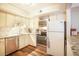 Modern kitchen with white cabinets, stainless steel appliances, granite countertops, and wood-style flooring at 1890 Argentine St # C301, Georgetown, CO 80444
