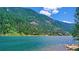 Breathtaking lake view with lush green mountains and clear blue water, creating a serene and picturesque setting at 1890 Argentine St # C301, Georgetown, CO 80444