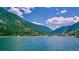 Picturesque lake view surrounded by mountains with some houses along the shoreline, reflecting in the calm waters at 1890 Argentine St # C301, Georgetown, CO 80444