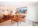 Comfortable living room featuring a dining area, a couch, and a large framed map on the wall at 1890 Argentine St # C301, Georgetown, CO 80444