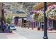 Charming street view with colorful buildings and flower baskets, set against a mountain backdrop at 1890 Argentine St # C301, Georgetown, CO 80444