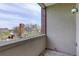 Balcony view of a nearby church and surrounding trees at 2200 S University Blvd # 313, Denver, CO 80210