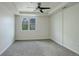 Spacious bedroom featuring plush carpeting, ample natural light, and a modern ceiling fan at 2200 S University Blvd # 313, Denver, CO 80210