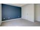 A bedroom features a blue accent wall at 2200 S University Blvd # 313, Denver, CO 80210