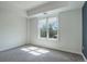 A bright, naturally lit bedroom with a large window at 2200 S University Blvd # 313, Denver, CO 80210