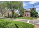 Exterior view of several brick buildings and grassy lawns at 2200 S University Blvd # 313, Denver, CO 80210