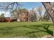 Red brick buildings with a large grassy lawn with trees at 2200 S University Blvd # 313, Denver, CO 80210