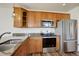 Kitchen boasts stainless steel appliances, granite countertops and wooden cabinetry at 2200 S University Blvd # 313, Denver, CO 80210
