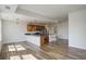 Open kitchen and living room floorplan featuring stainless appliances and breakfast bar seating at 2200 S University Blvd # 313, Denver, CO 80210
