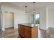 Bright kitchen featuring a spacious island with granite countertops and modern pendant lighting at 2200 S University Blvd # 313, Denver, CO 80210