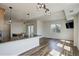 Bright open floor plan with breakfast bar, dining area, and sliding doors to balcony at 2200 S University Blvd # 313, Denver, CO 80210