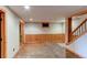 Spacious finished basement with wood paneling, concrete floors, and recessed lighting at 6066 S Monaco Way, Centennial, CO 80111