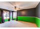 Bedroom with two-tone paint, carpet, and two windows at 6066 S Monaco Way, Centennial, CO 80111