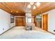 Bedroom with wood plank ceiling, built-in desk, and en-suite bathroom at 6066 S Monaco Way, Centennial, CO 80111