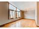 Airy living room with large windows and a chandelier at 6066 S Monaco Way, Centennial, CO 80111