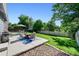 Inviting backyard patio with comfortable seating and lush green lawn at 6074 S Dudley Way, Littleton, CO 80123