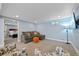Finished basement with seating area and an adjacent room in the background at 6074 S Dudley Way, Littleton, CO 80123