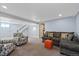 Finished basement with seating area, carpeted floors, and neutral paint at 6074 S Dudley Way, Littleton, CO 80123