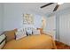Comfortable bedroom features a daybed with pillows and decor on the walls at 6074 S Dudley Way, Littleton, CO 80123