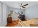 Bedroom with desk area, wood floors, and closet for storage at 6074 S Dudley Way, Littleton, CO 80123