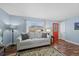 Cozy living room with large window, hardwood floors, and neutral paint at 6074 S Dudley Way, Littleton, CO 80123