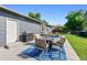 Cozy backyard patio with a grill and comfortable seating, ideal for outdoor gatherings and enjoying the fresh air at 6074 S Dudley Way, Littleton, CO 80123
