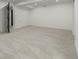 Spacious finished basement featuring neutral carpet, recessed lighting, and clean white walls at 5951 S Akron Way, Greenwood Village, CO 80111